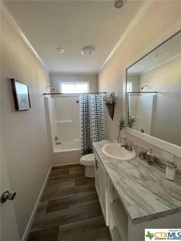 a bed room with furniture and a lamp