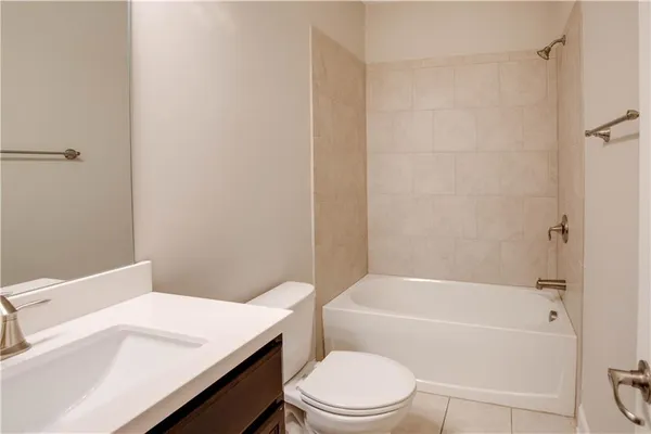 a bathroom with a sink a toilet and a bathtub