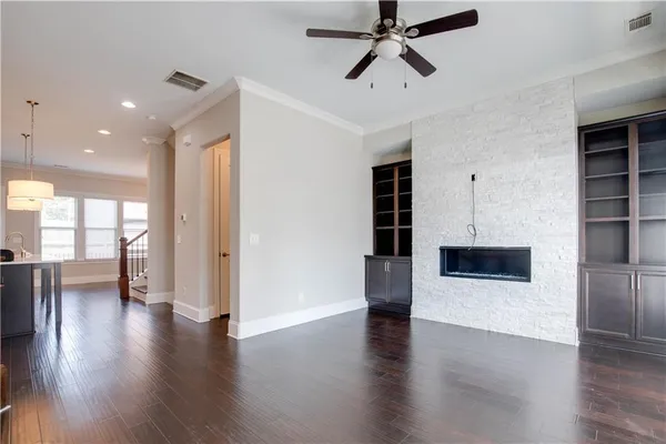 a view of a living room a window and wooden floor