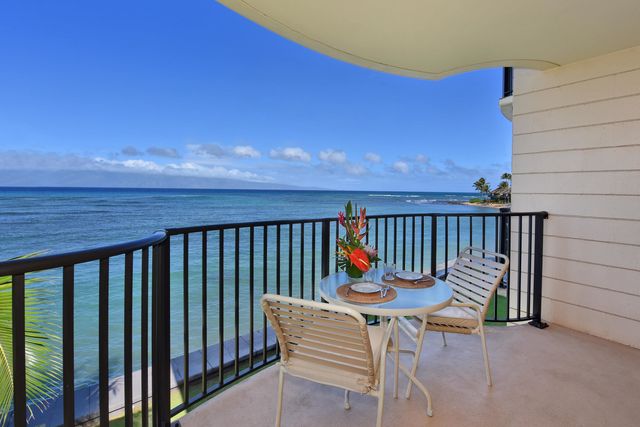 a view of balcony with wooden floor and outdoor seating
