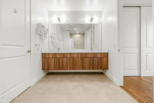 a view of a room with cabinet and mirror