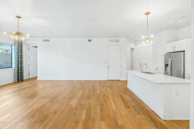 a view of a kitchen with sink and microwave