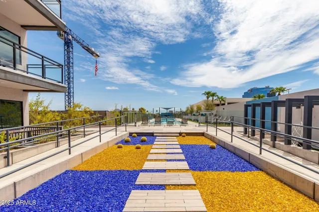 a swimming pool with outdoor seating yard and a building view