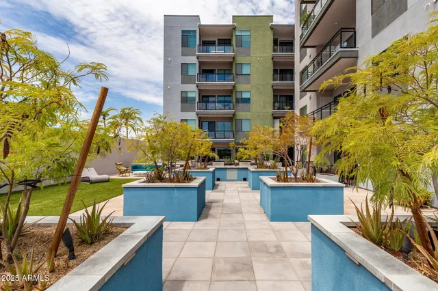 a view of a building with outdoor seating