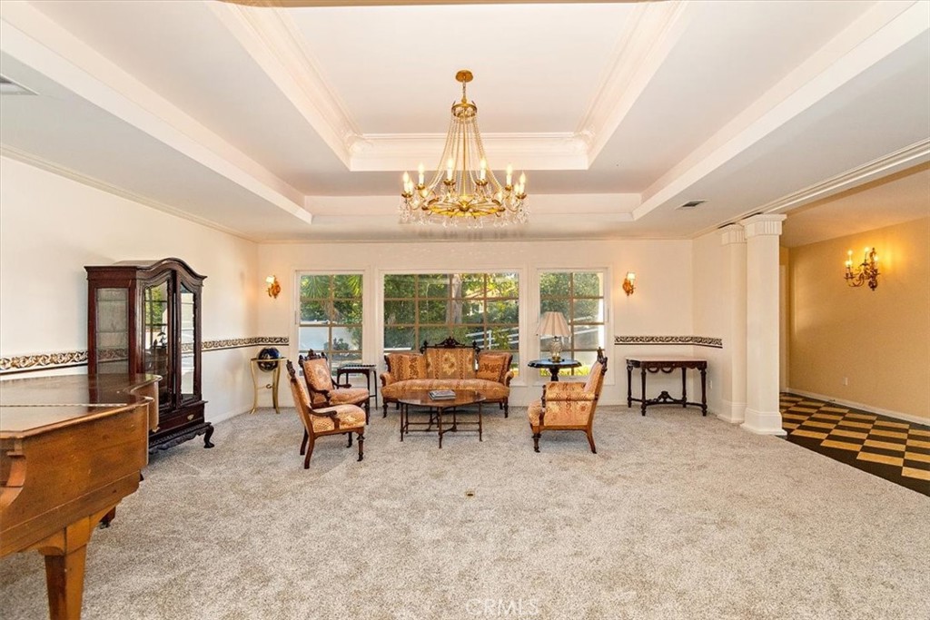 2 Quail Ridge Road South Rolling Hills, CA 90274 - Photo 16 of 67 a living room with furniture a fireplace and a chandelier