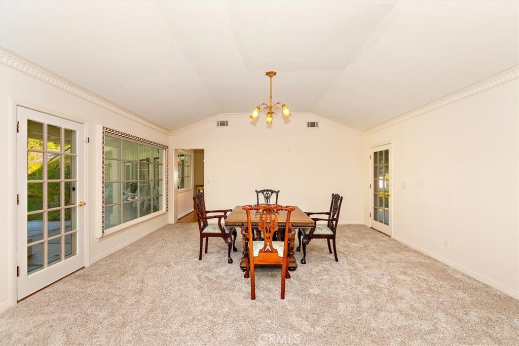 2 Quail Ridge Road South Rolling Hills, CA 90274 - Photo 18 of 67 a dining room with furniture and chandelier