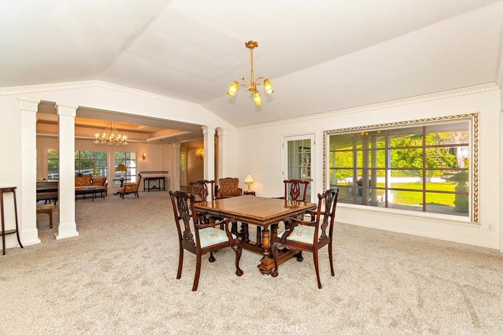 2 Quail Ridge Road South Rolling Hills, CA 90274 - Photo 19 of 67 a dining room with furniture water view and a fireplace