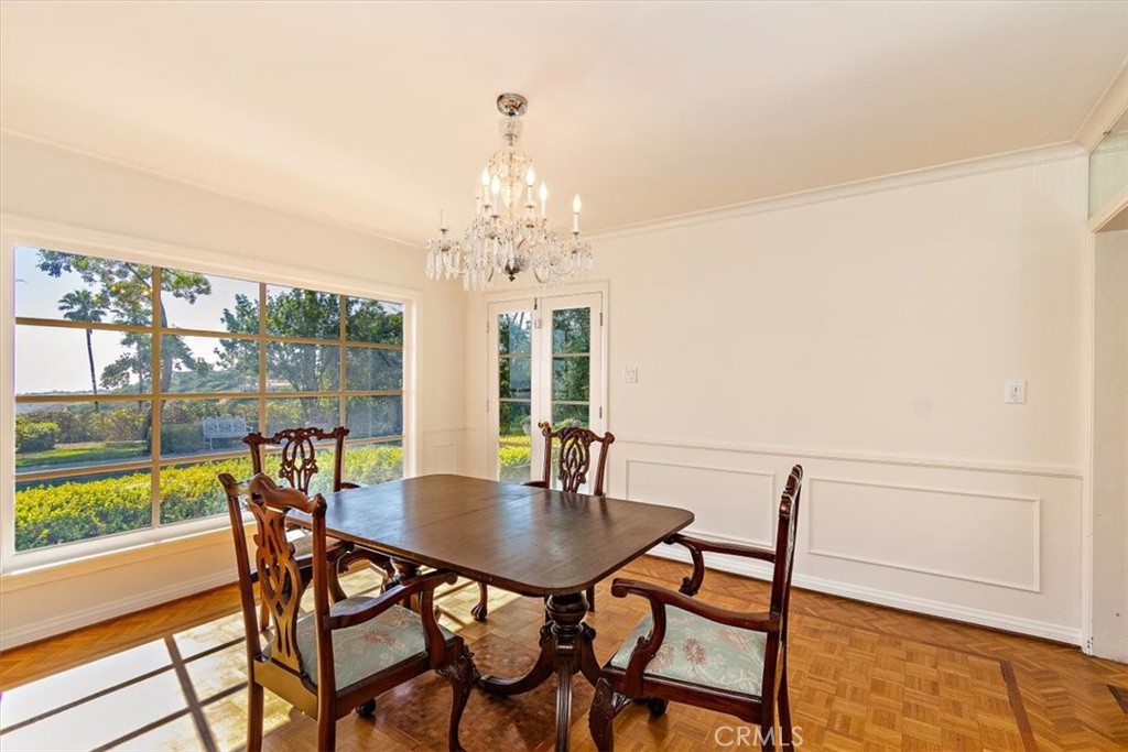 2 Quail Ridge Road South Rolling Hills, CA 90274 - Photo 23 of 67 a view of a dining room with furniture wooden floor and a chandelier