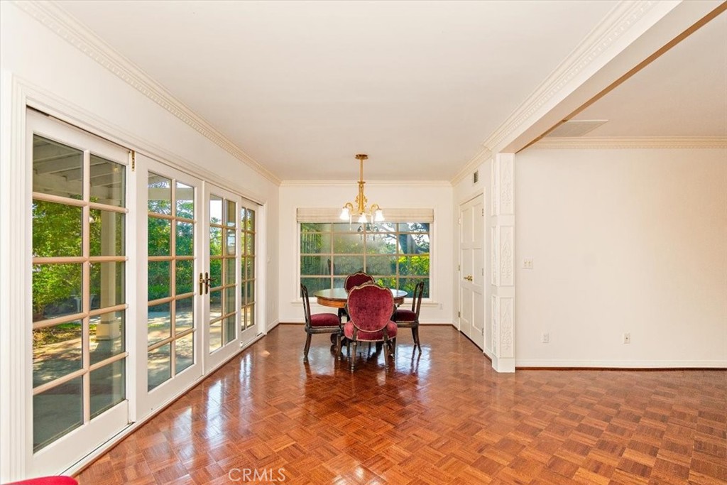 2 Quail Ridge Road South Rolling Hills, CA 90274 - Photo 24 of 67 a dining room with furniture large windows and wooden floor