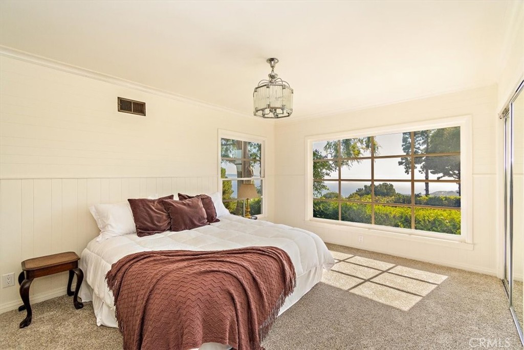 2 Quail Ridge Road South Rolling Hills, CA 90274 - Photo 36 of 67 a bedroom with a large bed and a window