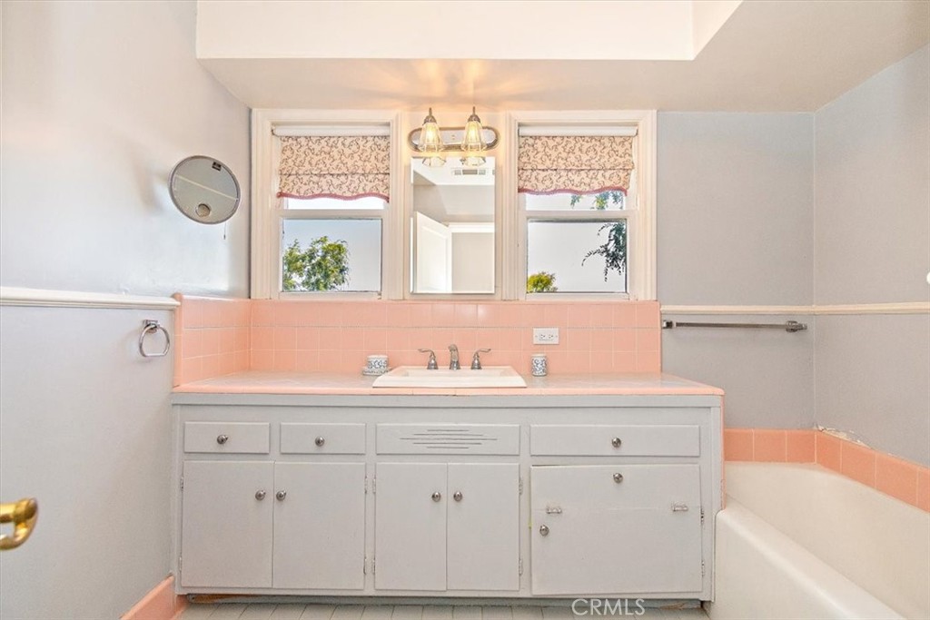 2 Quail Ridge Road South Rolling Hills, CA 90274 - Photo 40 of 67 a bathroom with a sink a mirror and a window