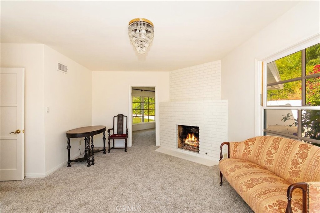 2 Quail Ridge Road South Rolling Hills, CA 90274 - Photo 41 of 67 a living room with furniture and a fireplace