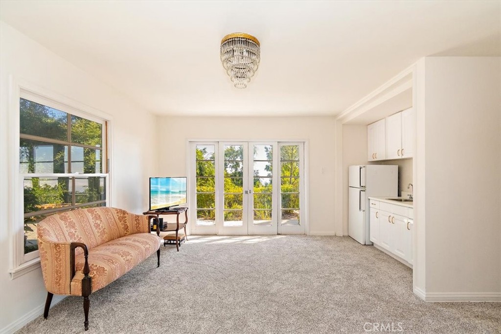 2 Quail Ridge Road South Rolling Hills, CA 90274 - Photo 42 of 67 a living room with furniture and a large window