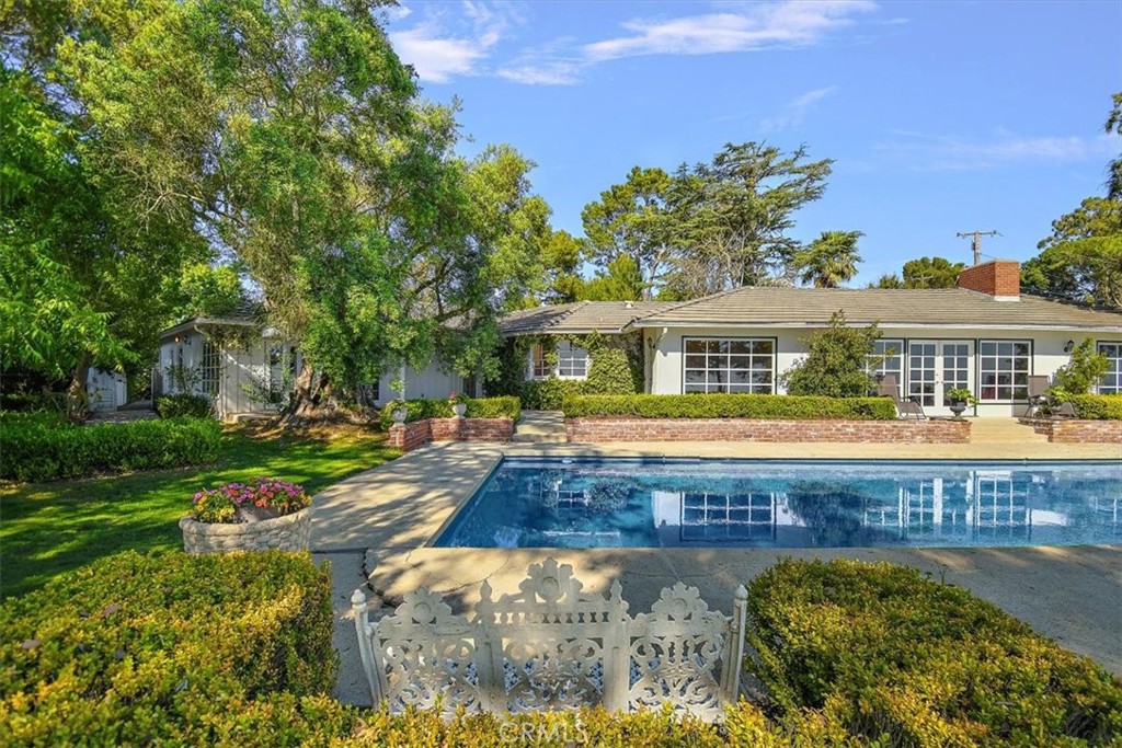 2 Quail Ridge Road South Rolling Hills, CA 90274 - Photo 10 of 67 a front view of a house with swimming pool