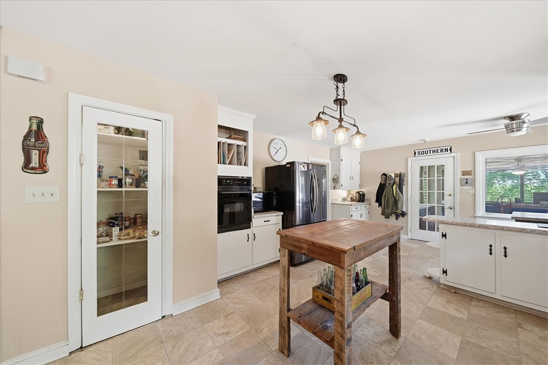 504 Jeb Stuart Avenue Anderson, SC 29621 - Photo 14 of 47 This spacious kitchen offers a pantry, modern appliances, and convenient access to outdoor living.