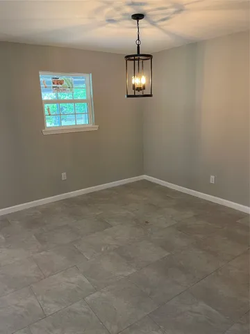 a view of hallway with wooden floor