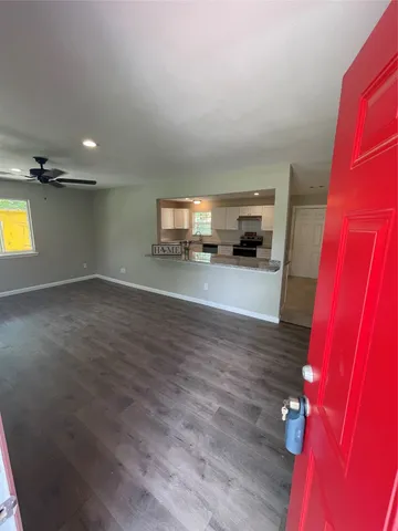 a view of a kitchen with a sink and a window