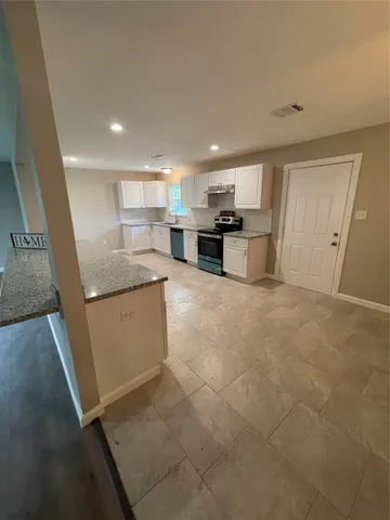 a view of a kitchen with a sink