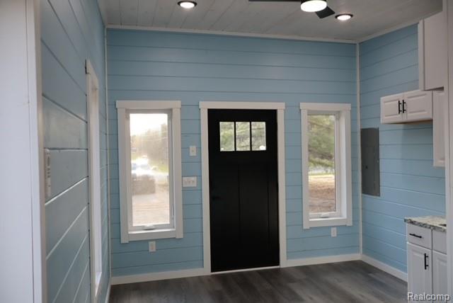 1545 South La Chance Road Lake City, MI 49651 - Photo 48 of 51 Foyer entrance with dark wood-style floors, recessed lighting, and wood walls