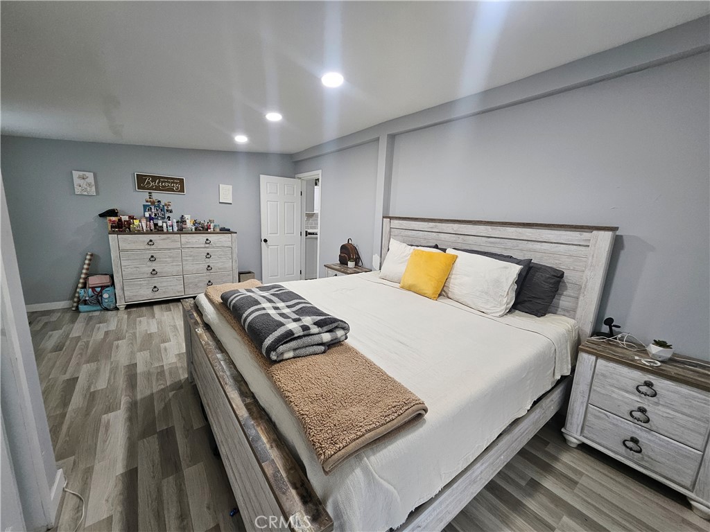 629 West Plum Street Compton, CA 90222 - Photo 11 of 15 a bedroom with a bed and a night stand