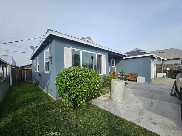 a front view of a house with a yard and porch