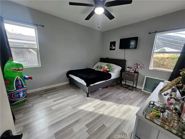a room with furniture and a wooden floor