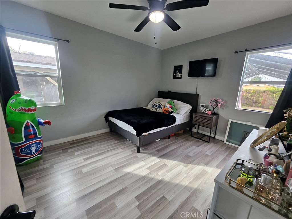 629 West Plum Street Compton, CA 90222 - Photo 8 of 15 a room with furniture and a wooden floor