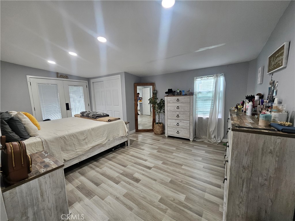 629 West Plum Street Compton, CA 90222 - Photo 10 of 15 a spacious bedroom with a bed and cabinets