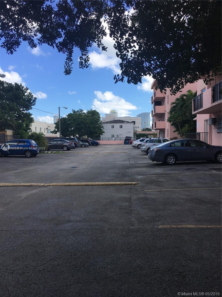 677 Southwest 9th Avenue, Unit 303 Miami, FL 33130 - Photo 13 of 34 a view of street with parked cars