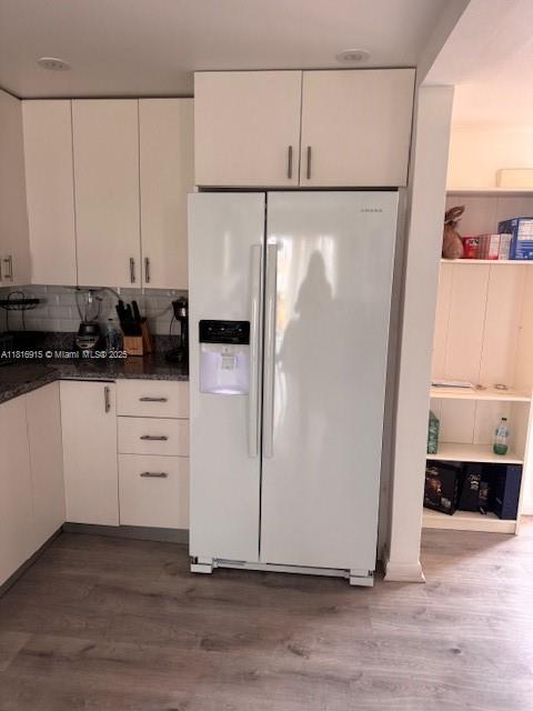677 Southwest 9th Avenue, Unit 303 Miami, FL 33130 - Photo 21 of 34 a kitchen with a refrigerator and a stove