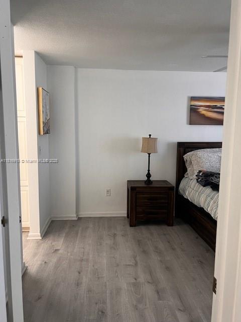 677 Southwest 9th Avenue, Unit 303 Miami, FL 33130 - Photo 22 of 34 a bedroom with a bed and a window