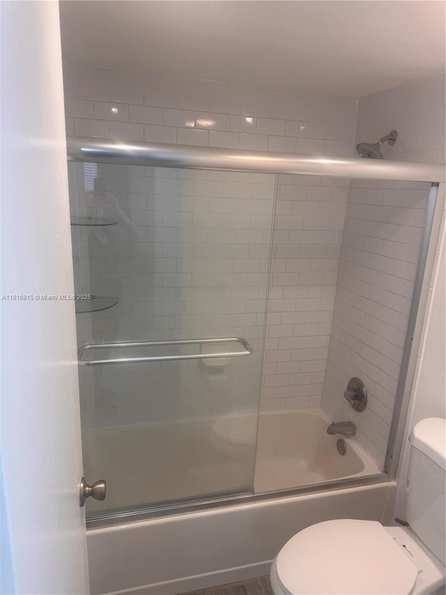 677 Southwest 9th Avenue, Unit 303 Miami, FL 33130 - Photo 25 of 34 a bathroom with a shower and a toilet