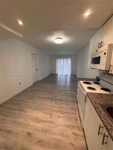 a kitchen with a stove and a sink