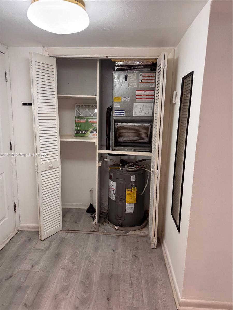 677 Southwest 9th Avenue, Unit 303 Miami, FL 33130 - Photo 6 of 34 a view of kitchen and utility room