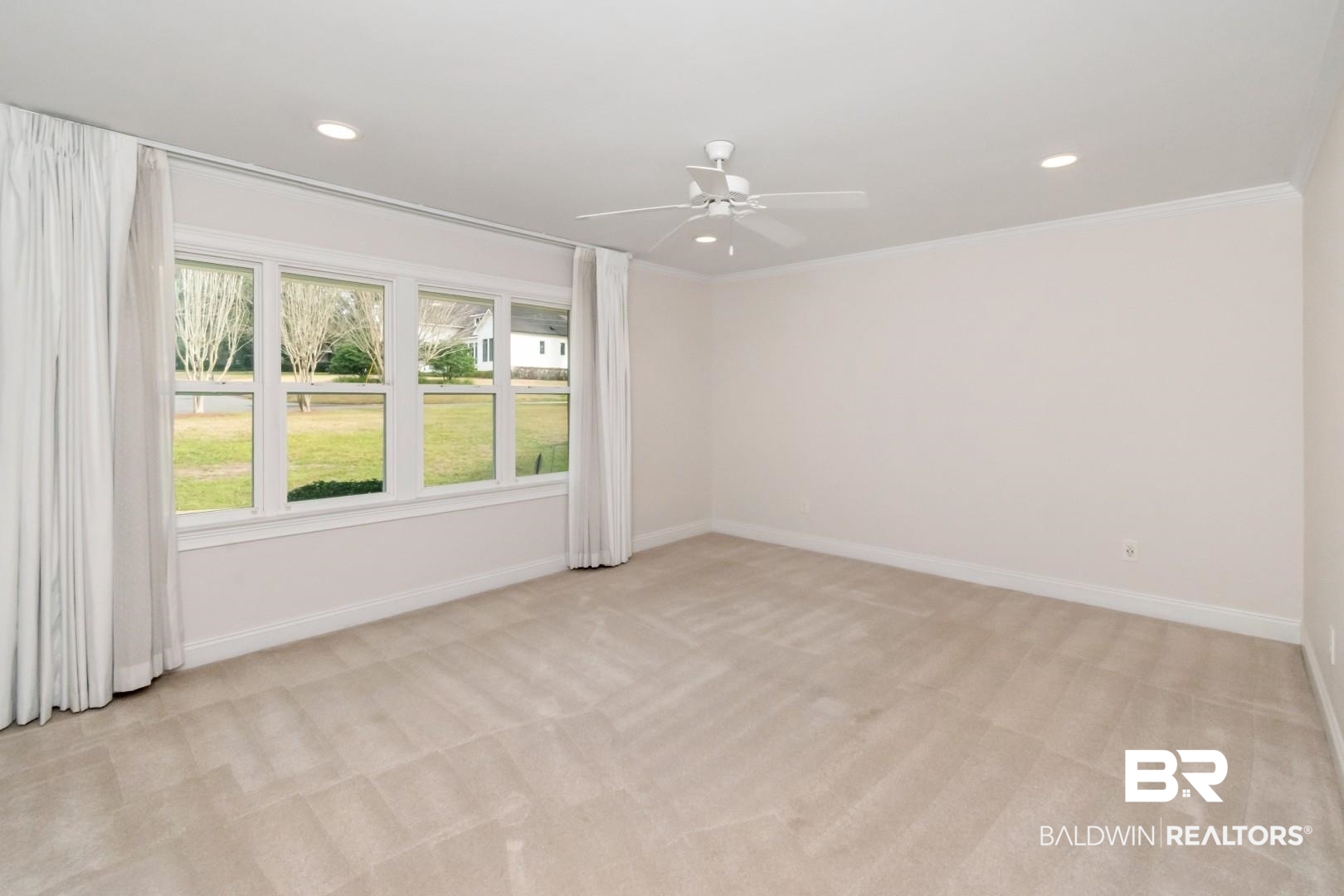 231 Rochester Road Mobile, AL 36608 - Photo 28 of 51 Empty room featuring light carpet, ceiling fan, and recessed lighting