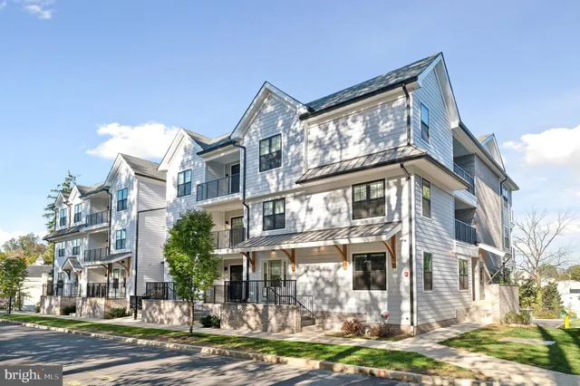 a front view of a building with a yard
