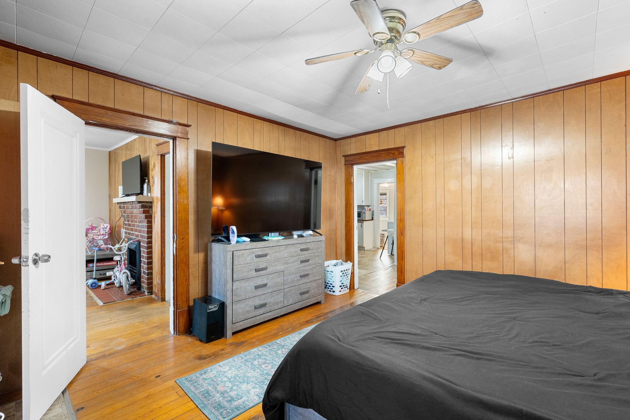 1710 County Hospital Road Nashville, TN 37218 - Photo 9 of 27 a bedroom with a bed and a flat tv screen on dresser