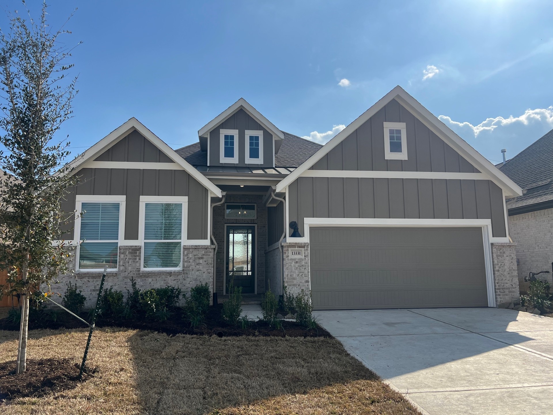 a front view of a house with garden