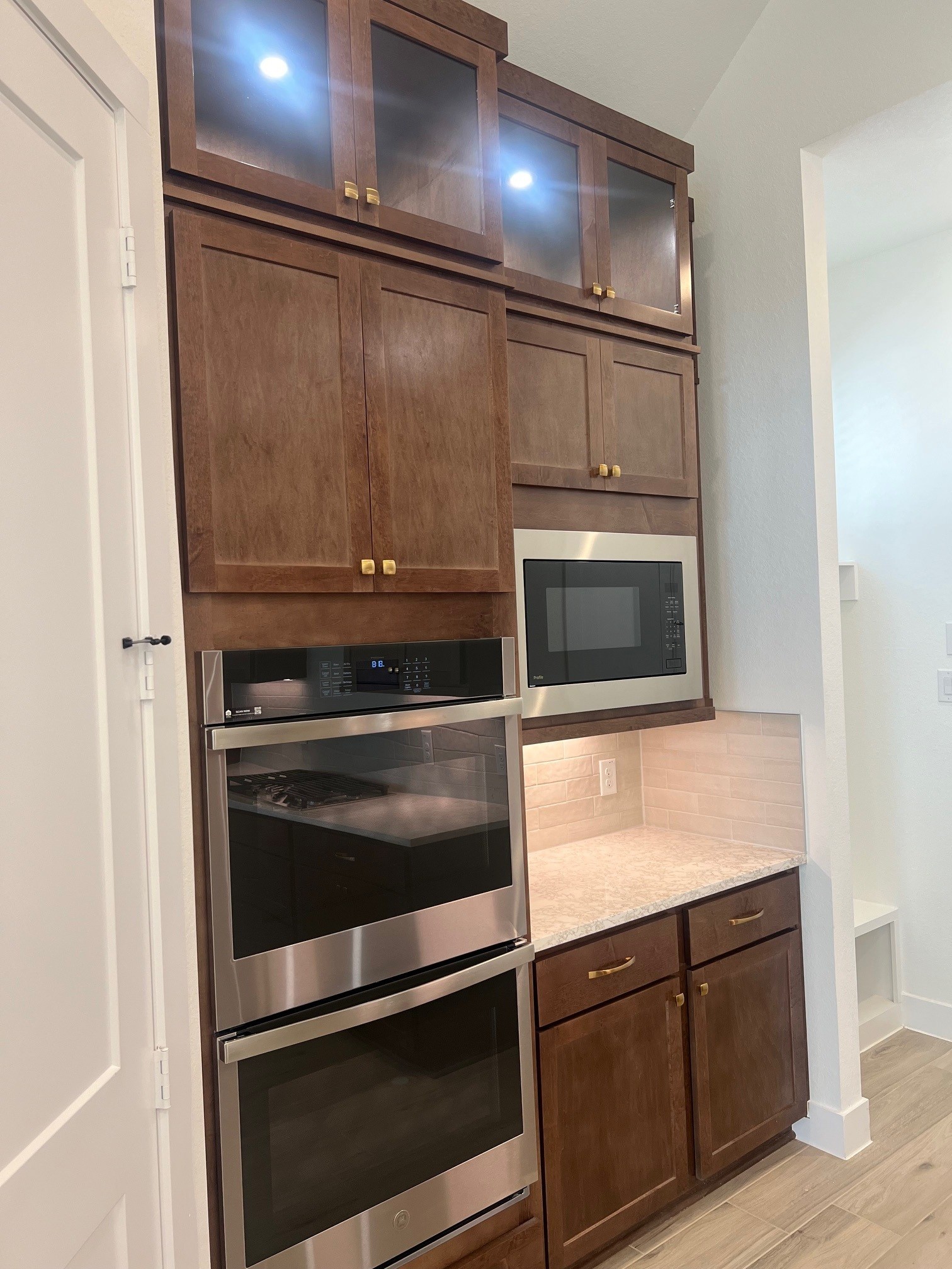 13331 Valley Orchard Tomball, TX 77375 - Photo 7 of 30 a kitchen with wooden floor and a stove top oven