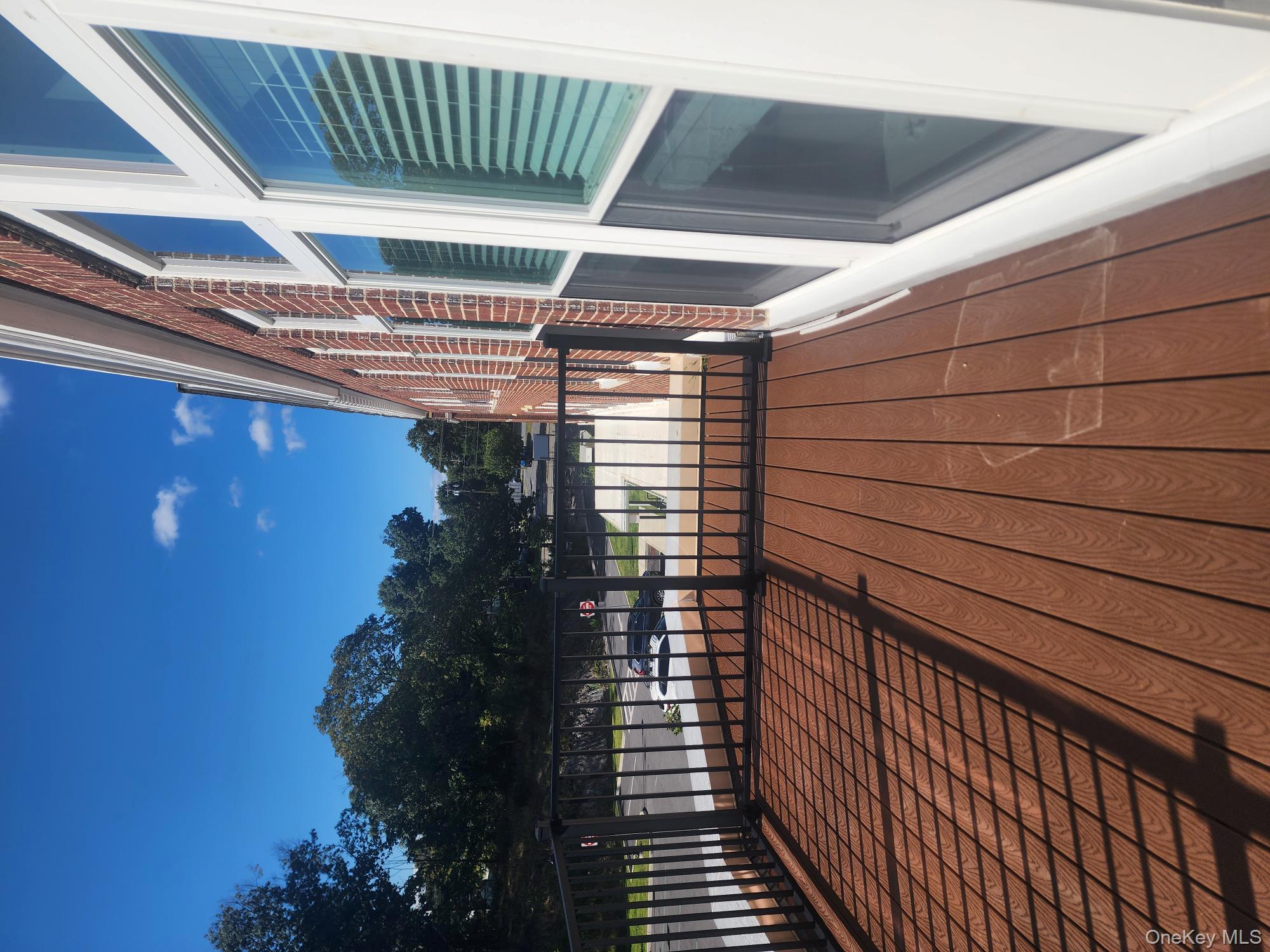 17-anya Court, Unit 301 Poughkeepsie, NY 12603 - Photo 6 of 9 a view of balcony with wooden floor and fence