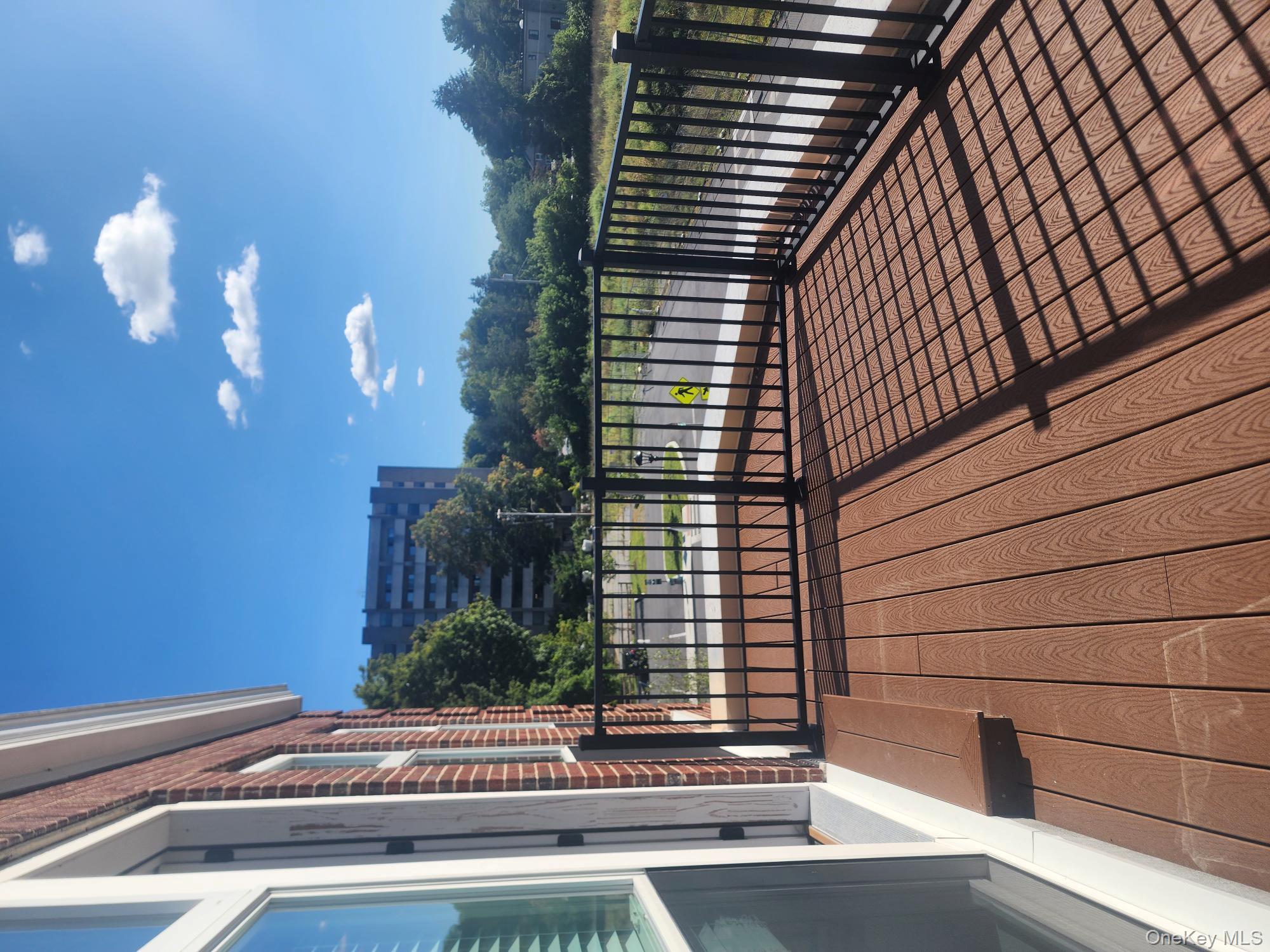17-anya Court, Unit 301 Poughkeepsie, NY 12603 - Photo 7 of 9 a view of balcony with wooden floor and fence