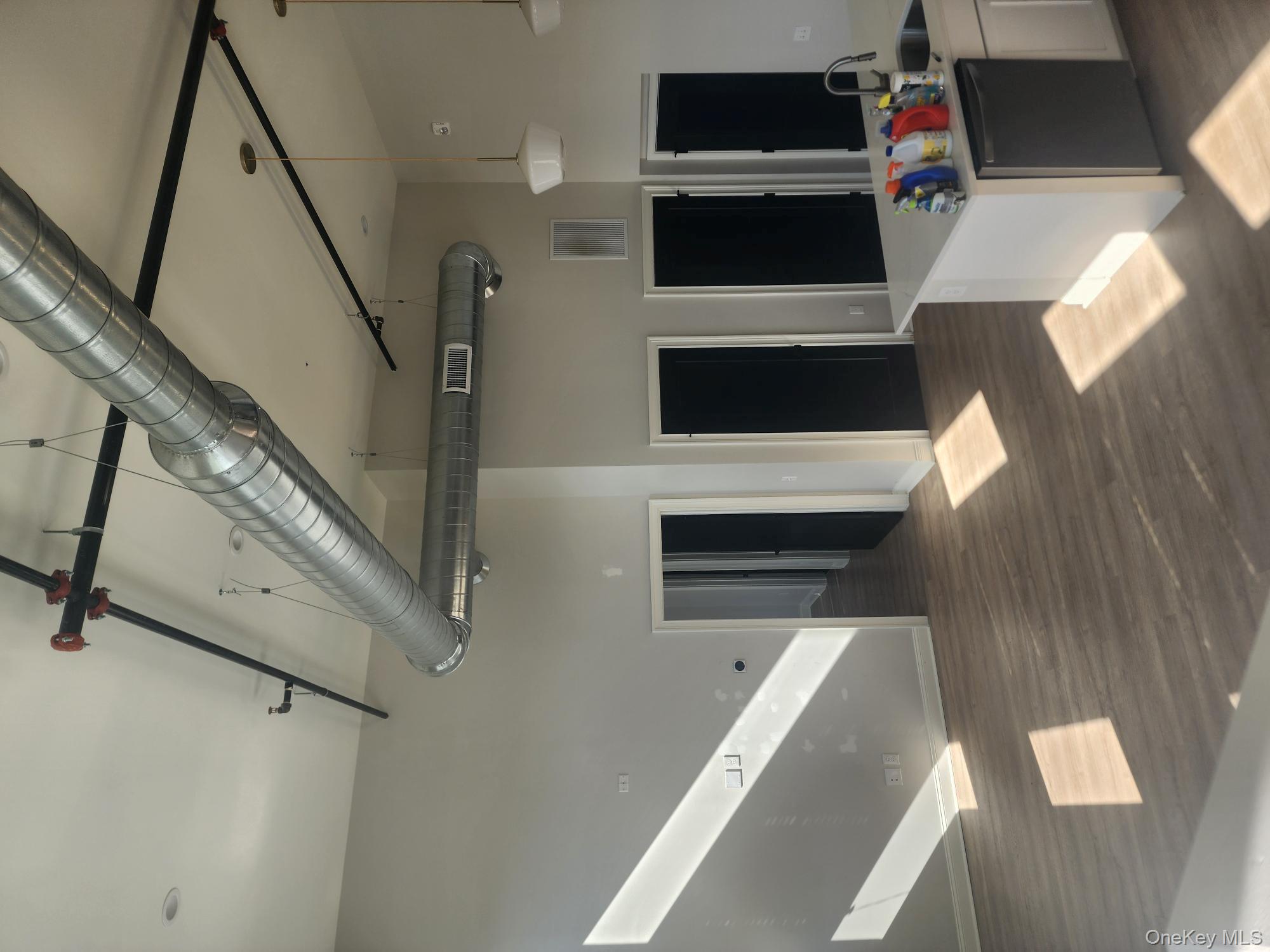 17-anya Court, Unit 301 Poughkeepsie, NY 12603 - Photo 8 of 9 a living room with stainless steel appliances kitchen island granite countertop furniture and a fireplace