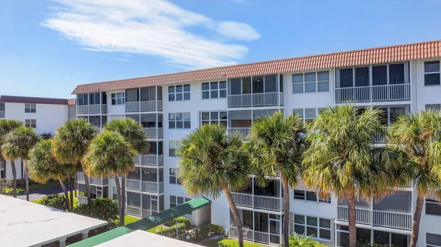 a front view of a building with garden