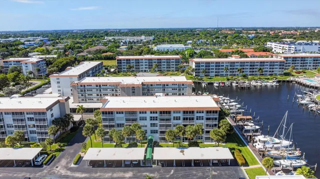 a view of a balcony with chairs and a table