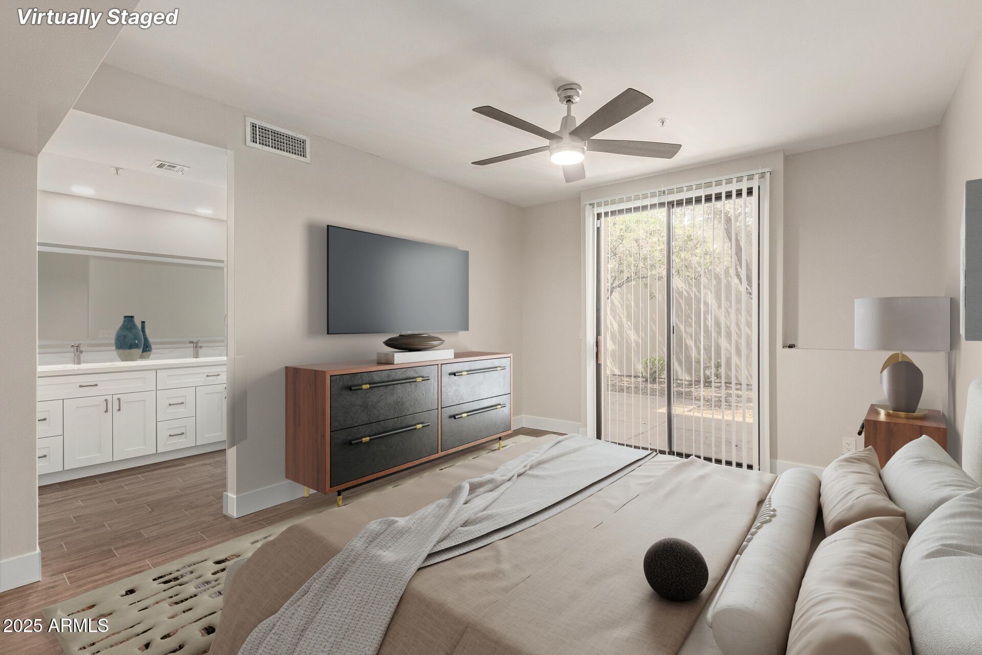 7700 East Gainey Ranch Road, Unit 102 Scottsdale, AZ 85258 - Photo 14 of 40 a bedroom with a bed and a flat screen tv