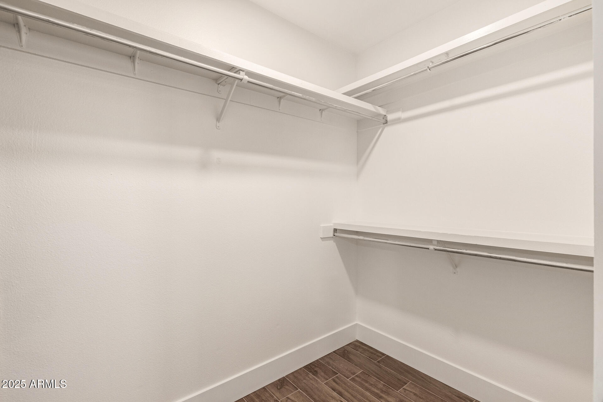 7700 East Gainey Ranch Road, Unit 102 Scottsdale, AZ 85258 - Photo 17 of 40 a view of an empty walk in closet
