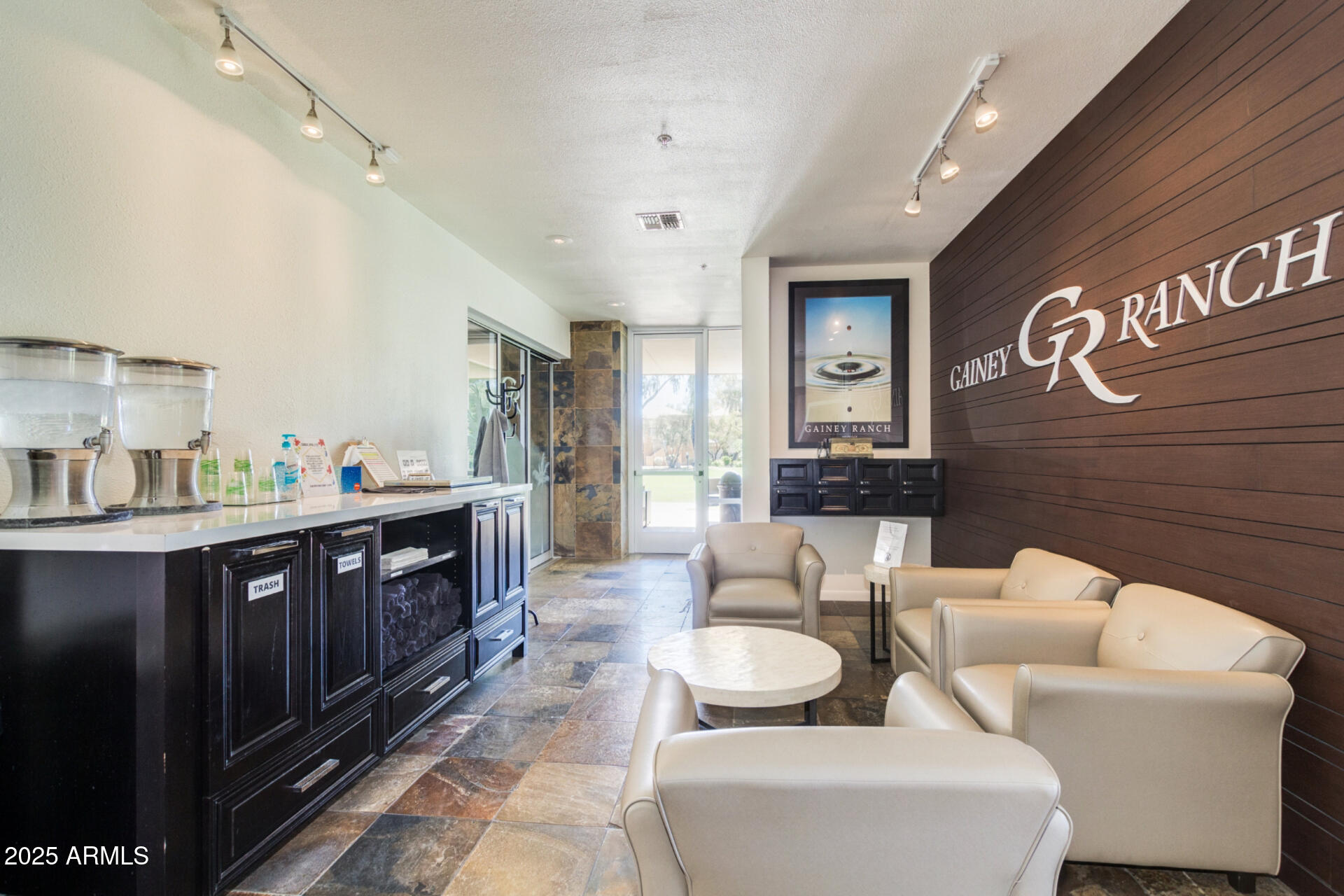 7700 East Gainey Ranch Road, Unit 102 Scottsdale, AZ 85258 - Photo 28 of 40 a living room with furniture and wooden floor