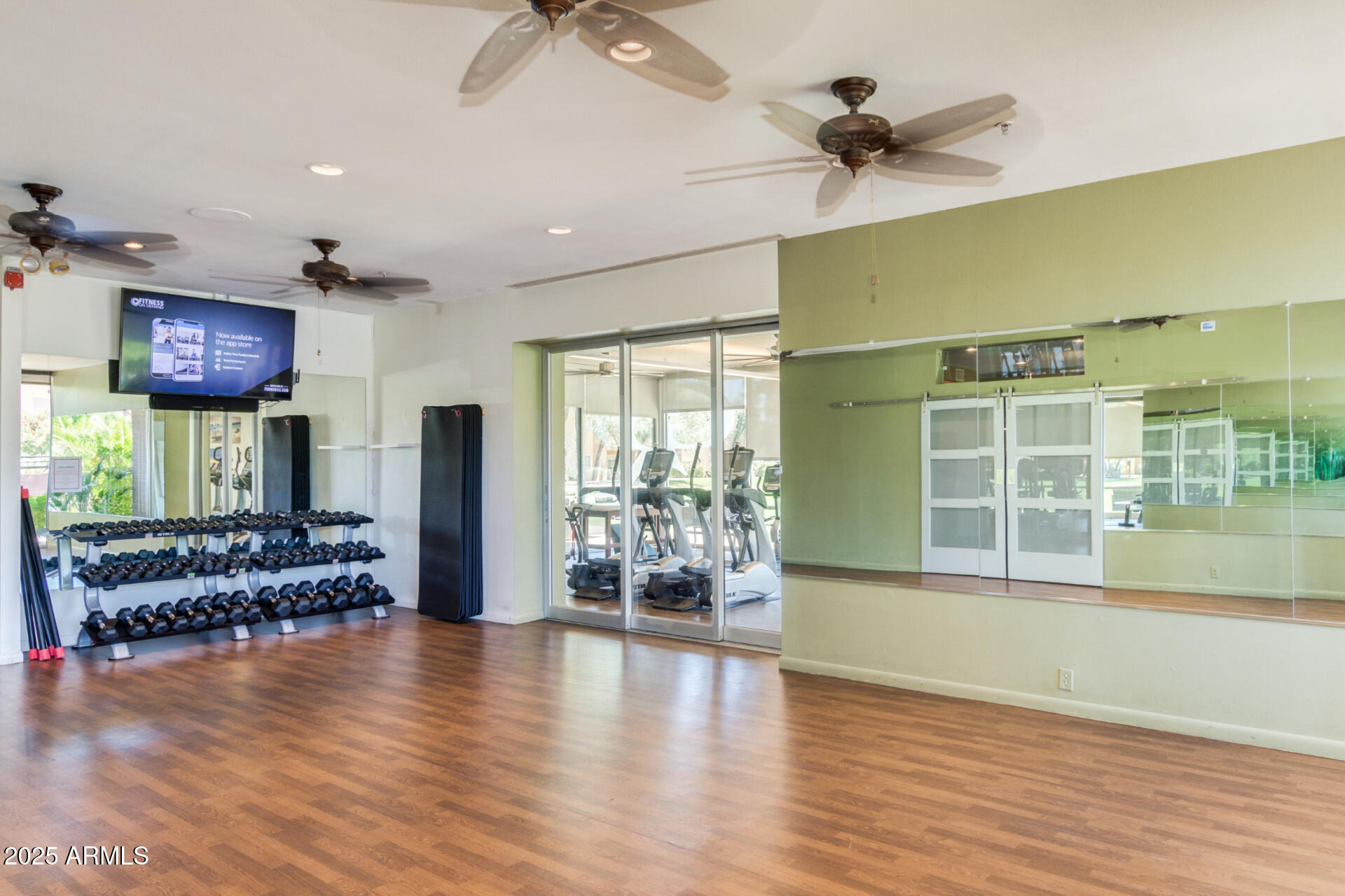 7700 East Gainey Ranch Road, Unit 102 Scottsdale, AZ 85258 - Photo 34 of 40 a living room with furniture and a large window