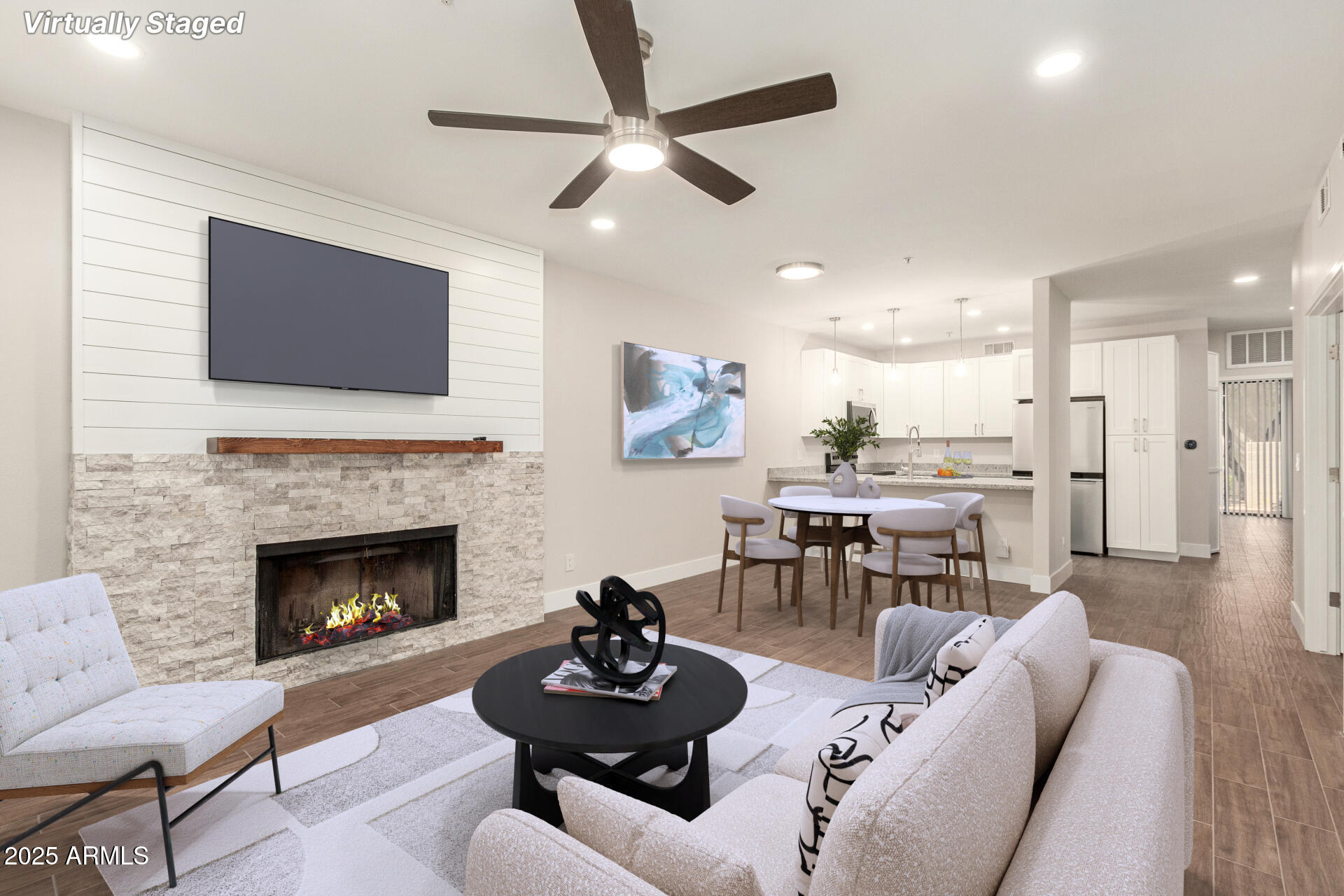 7700 East Gainey Ranch Road, Unit 102 Scottsdale, AZ 85258 - Photo 4 of 40 a living room with furniture and a fireplace