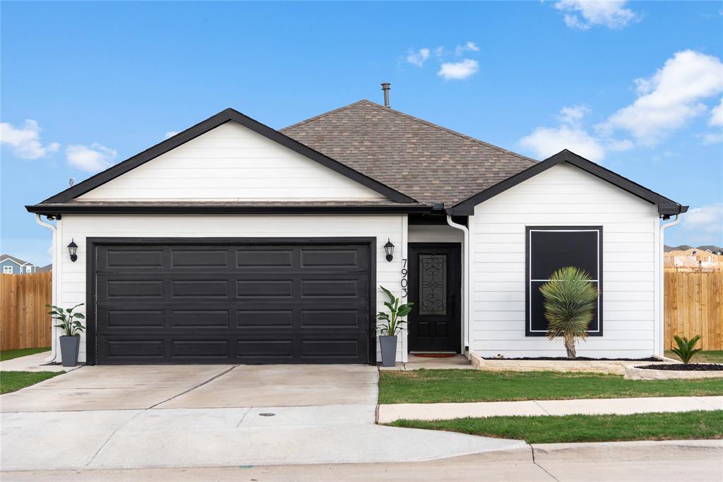 7903 Big Timber Trail Ponder, TX 76259 - Photo 1 of 1 a front view of a house with a yard and garage